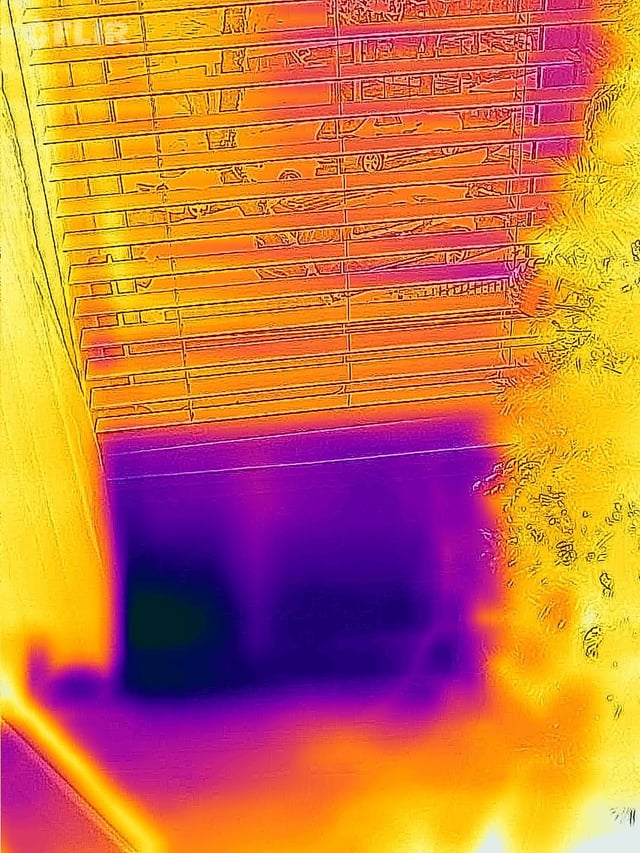 Thermal image showing missing or saturated insulation in wall cavity, building inspection NZ 